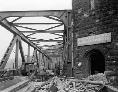 File source: http://commons.wikimedia.org/wiki/File:CROSS_THE_RHINE_WITH_DRY_FEET_COURTESY_OF_9TH_ARM%27D_DIV-LUDENDORFF_BRIDGE.jpg